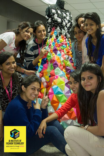  JD FASHION DESIGN STUDENTS STAND PROUD AGAINST THEIR INSTALLATION