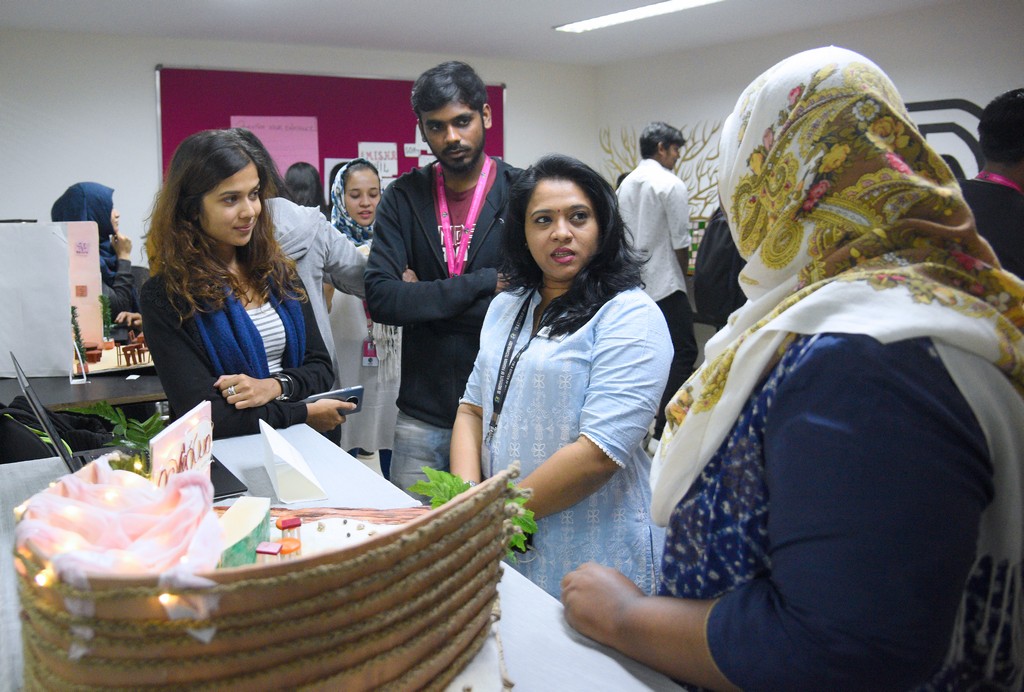 STUDENTS OF INTERIOR DESIGN DISPLAY MINIATURE RETAIL SPACE LAYOUTS 1