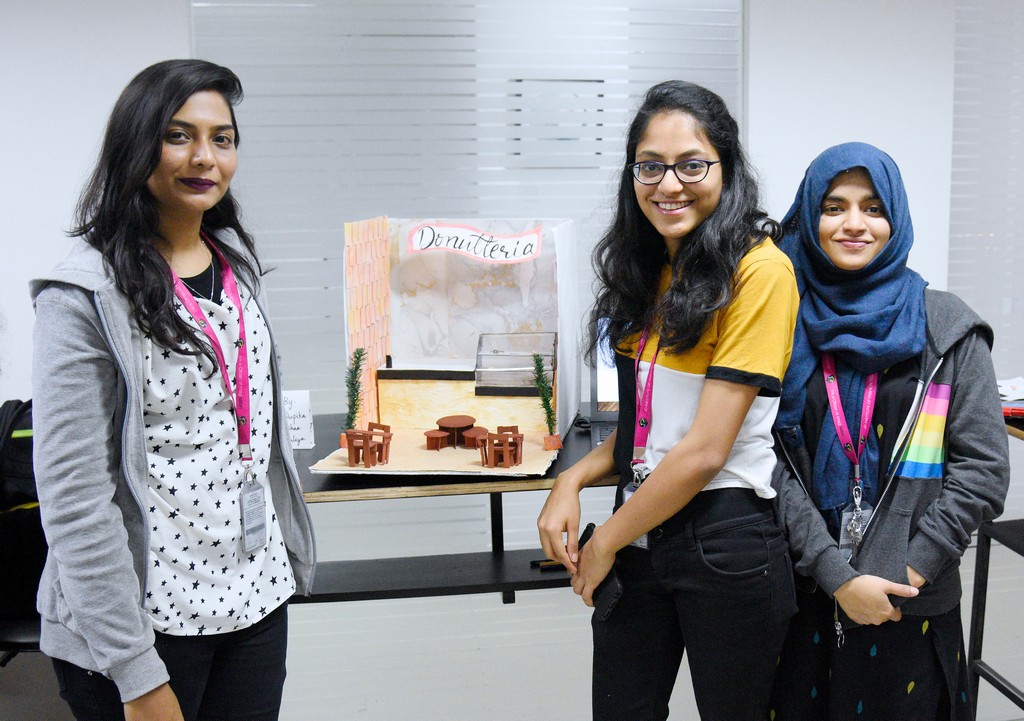 STUDENTS OF INTERIOR DESIGN DISPLAY MINIATURE RETAIL SPACE LAYOUTS 2