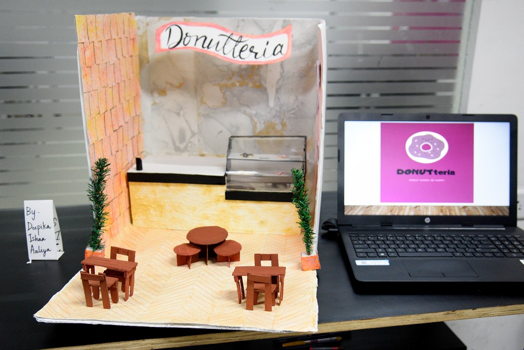 STUDENTS OF INTERIOR DESIGN DISPLAY MINIATURE RETAIL SPACE LAYOUTS 3