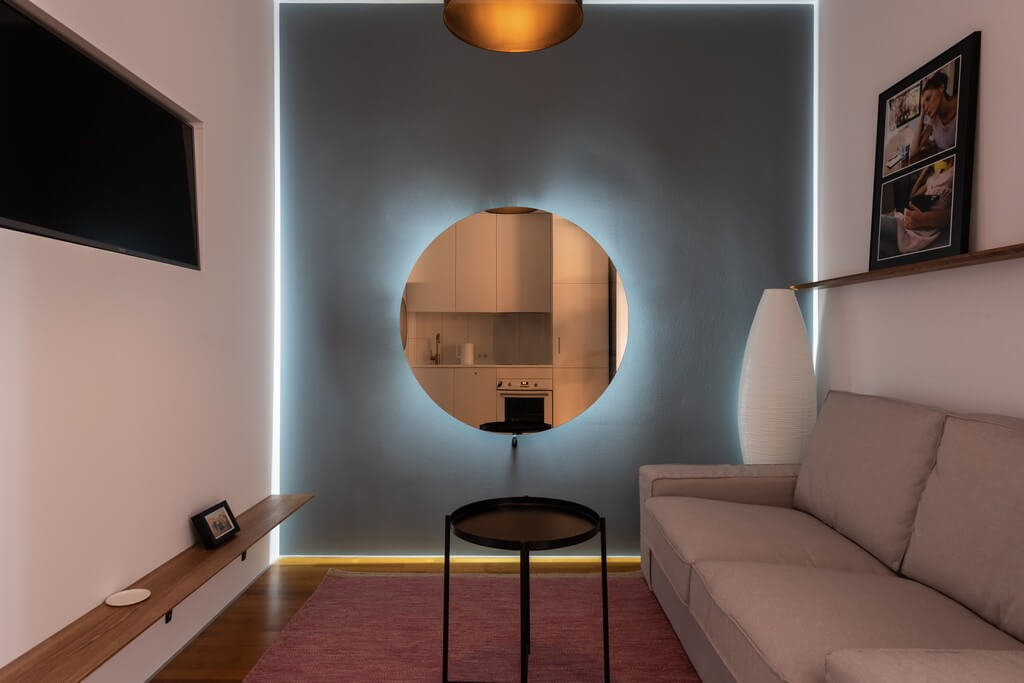 Different types of lighting are incorporated into a living room based on the needs and preferences of the clients.