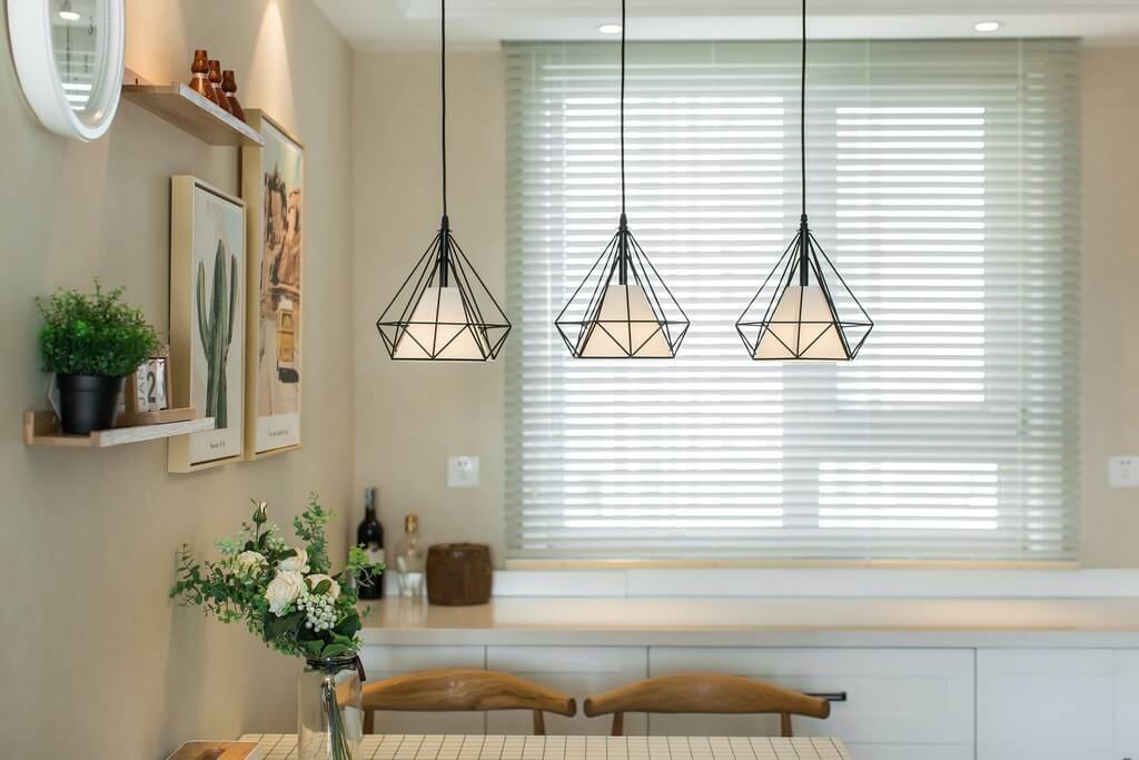 Different types of lighting are incorporated into a living room based on the needs and preferences of the clients.