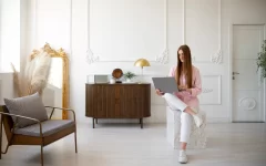 woman using laptop minimal decorated room